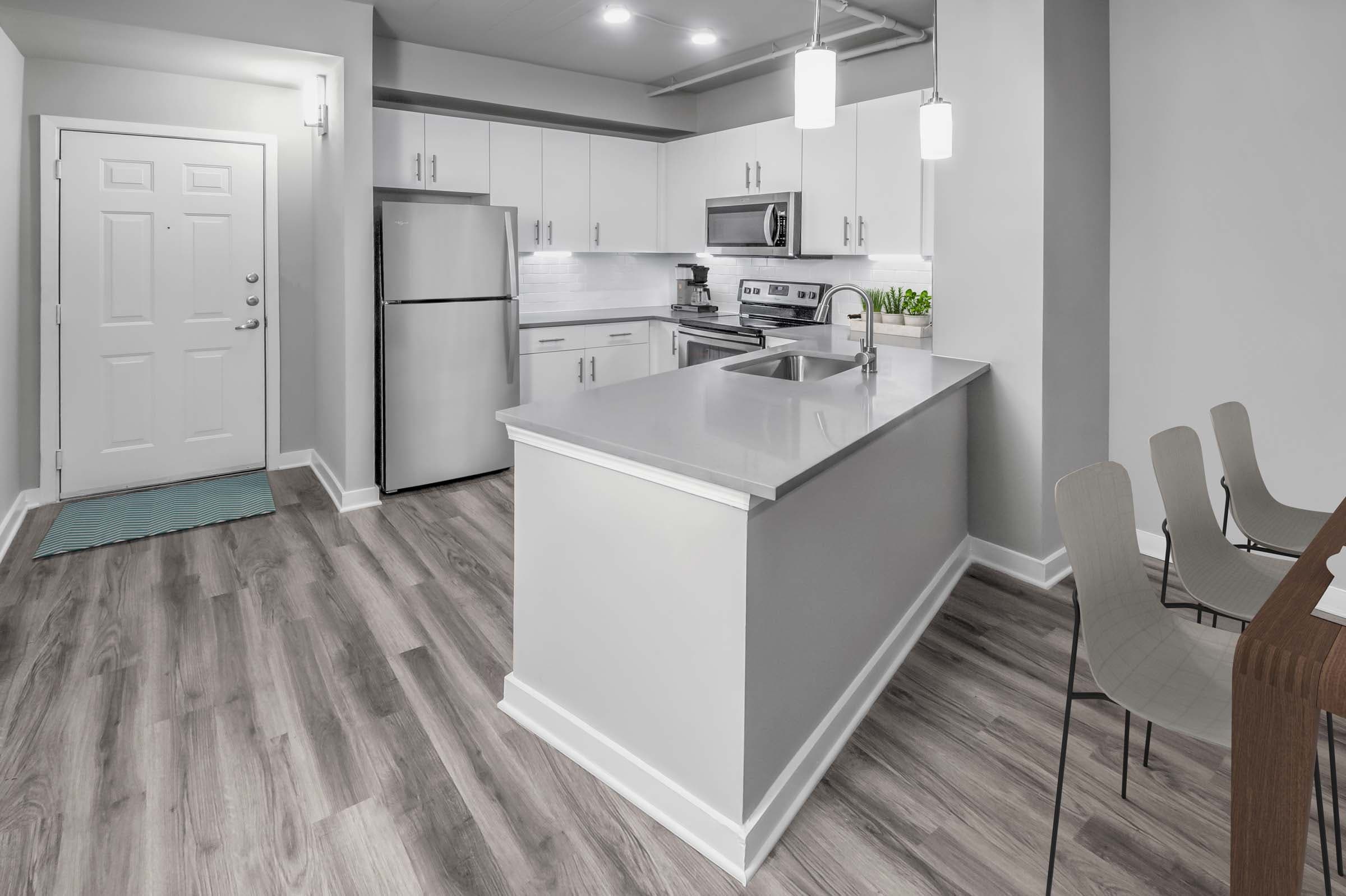Contemporary Midrise Kitchen: Hardwood-Style Flooring Throughout