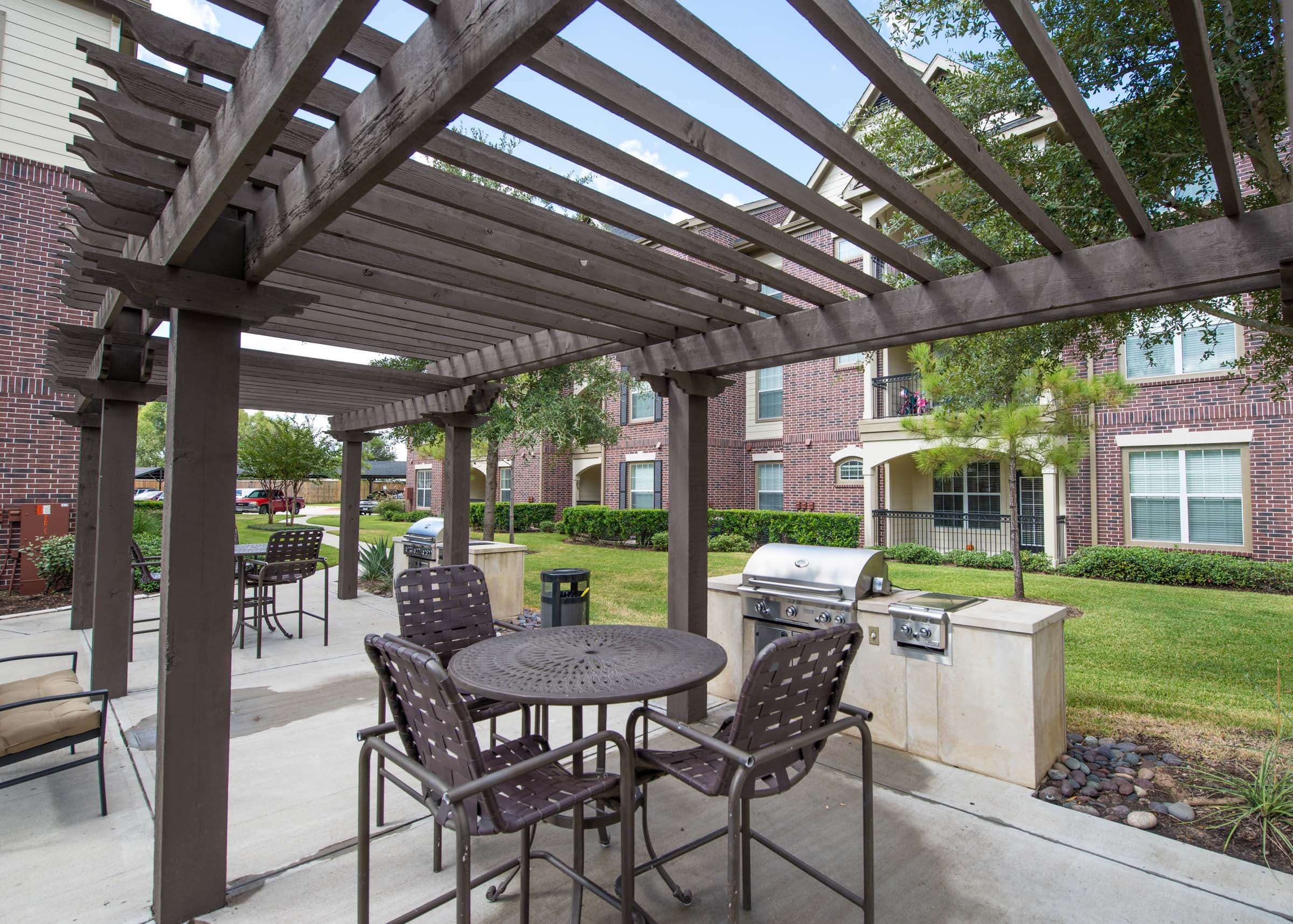 Resident Courtyard with Grilling Stations and Outdoor Seating