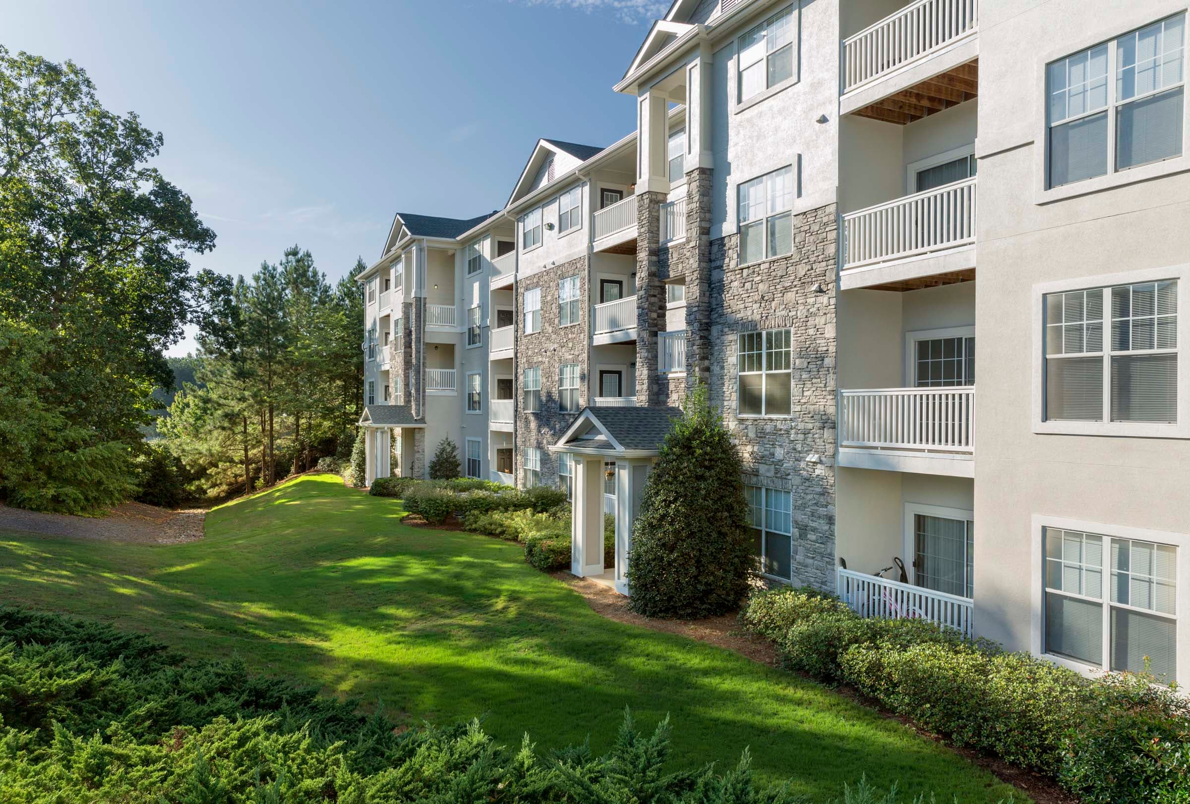 Private Balconies Overlooking Lush Landscaping