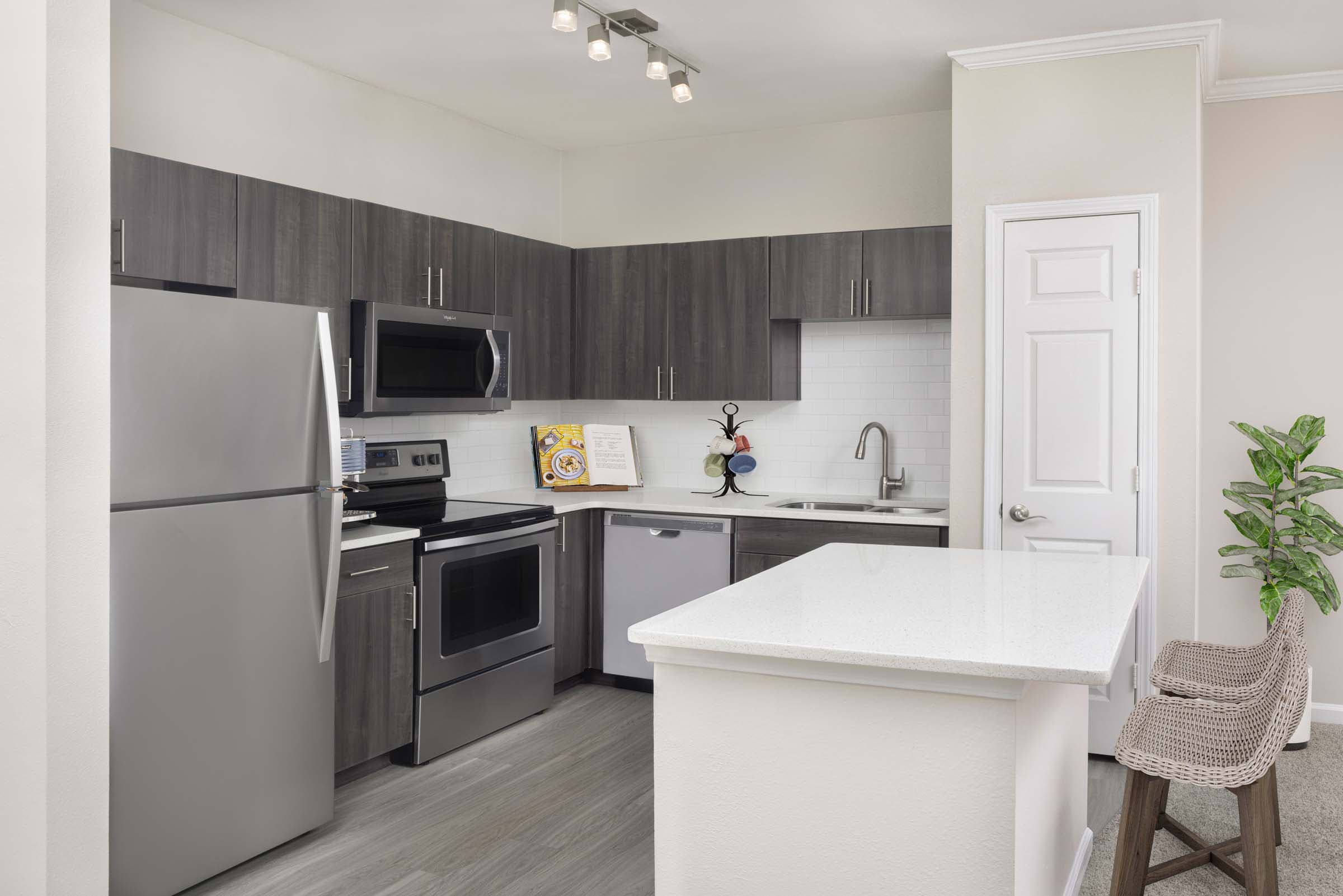 Kitchen with White Quartz Countertops