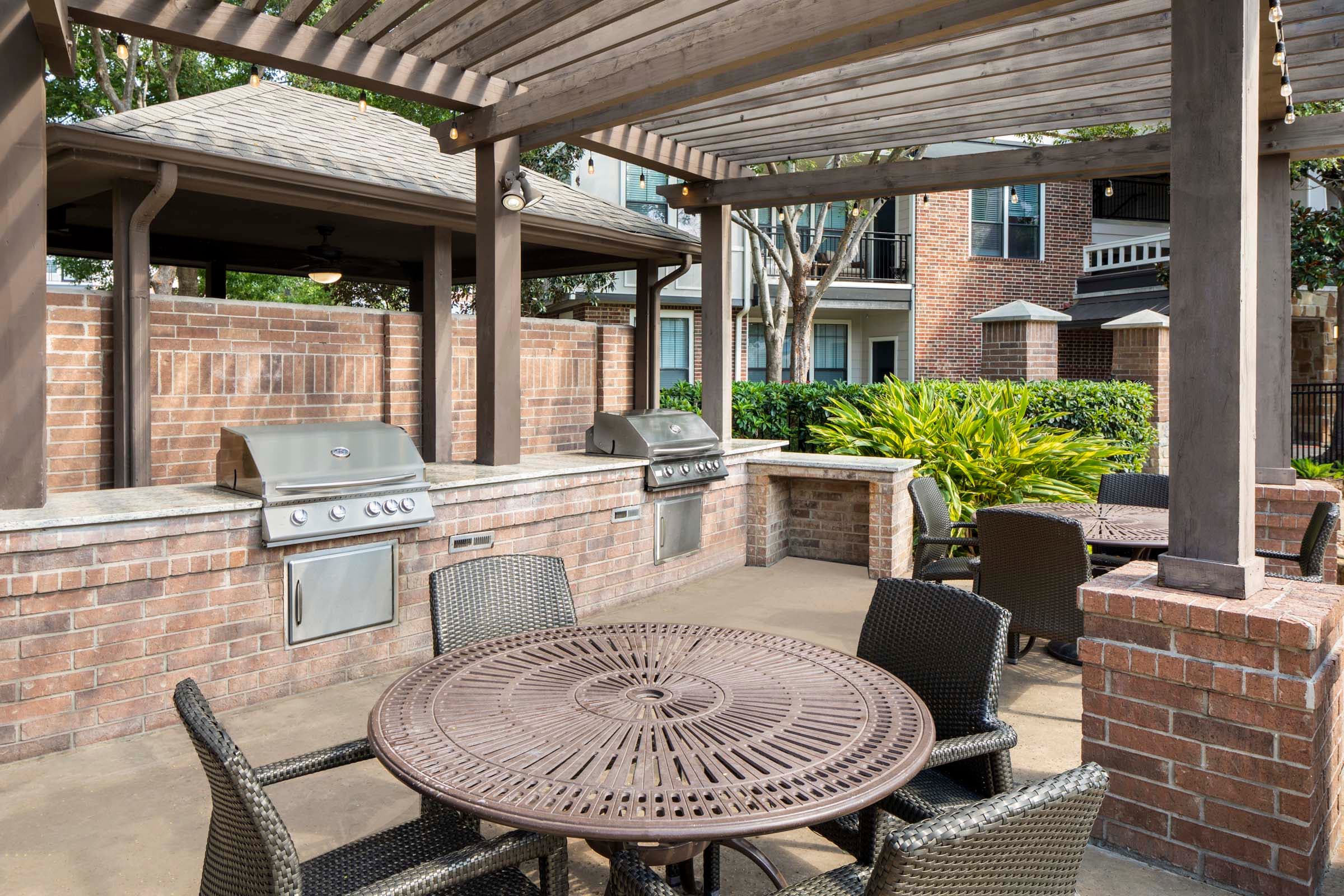 Resort-Style Pool with Outdoor Grilling Area and Dining Spaces