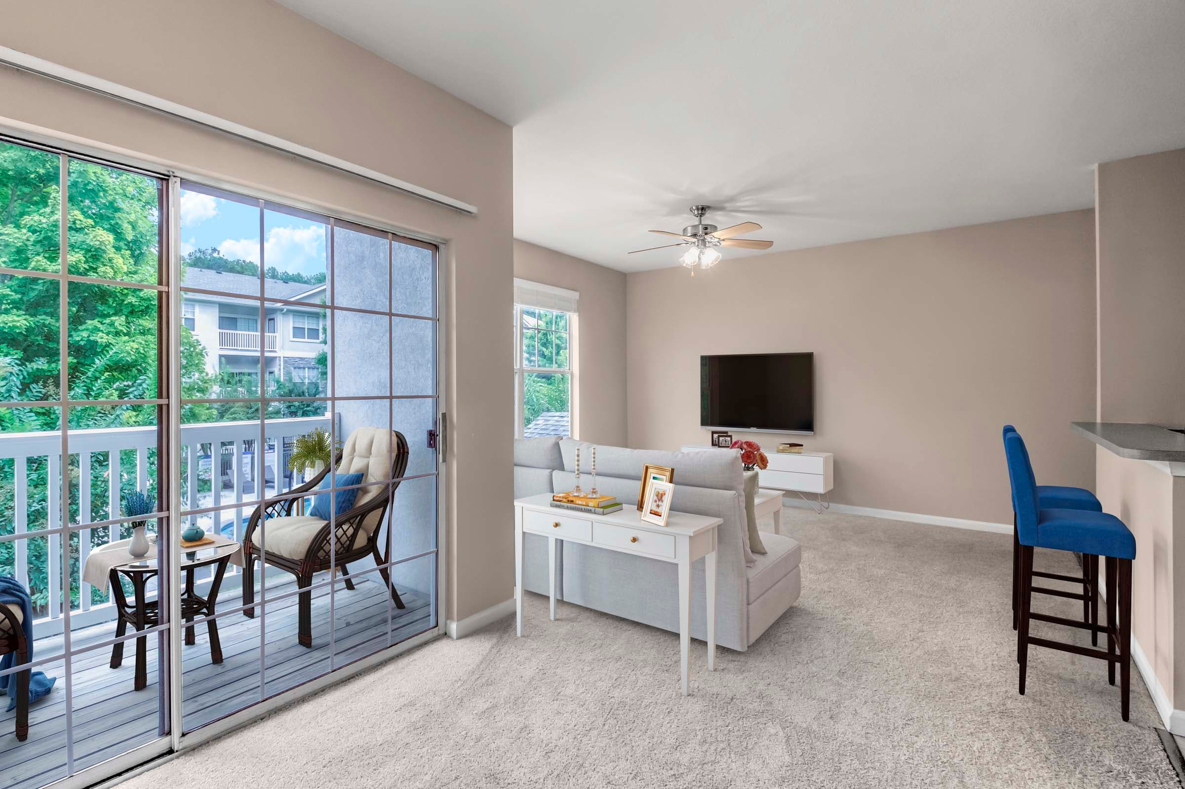 Expansive Living Space with Sliding Glass Door to Private Balcony