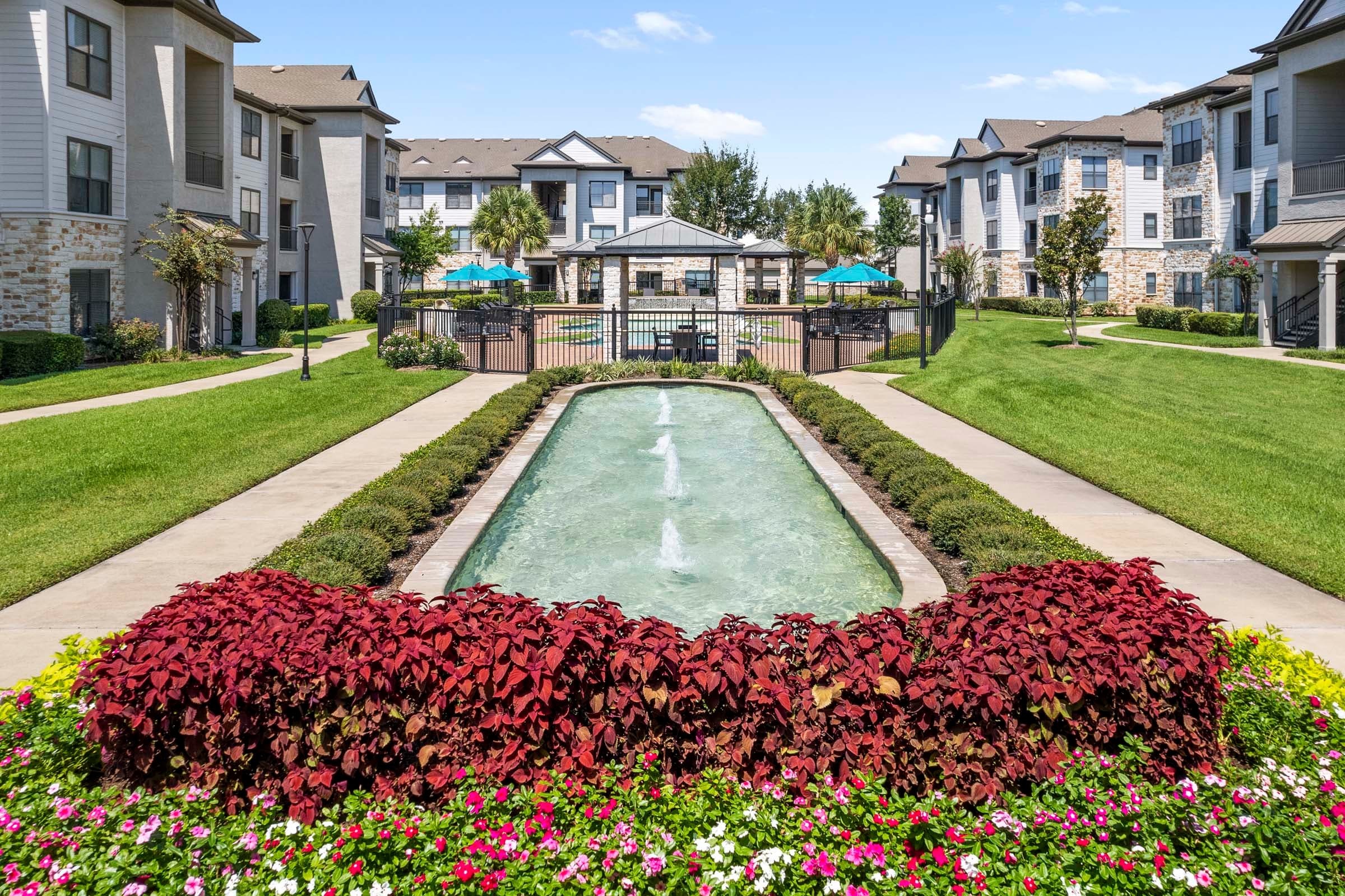 Relaxing Water Feature Next to Pool